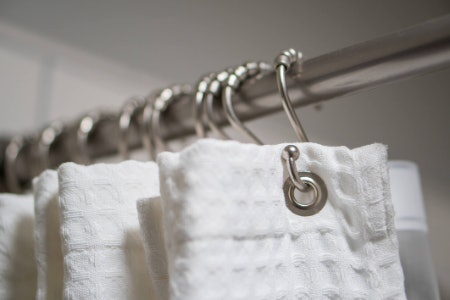 2. Decide on a Hanging Method: Hooks Are the Most Common but Eyelets Are the Tidier Option 