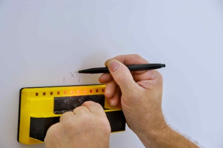 1. Choose an Electronic Cable Finder to Detect Live Wires or a Magnetic Stud Finder for Locating Nails 